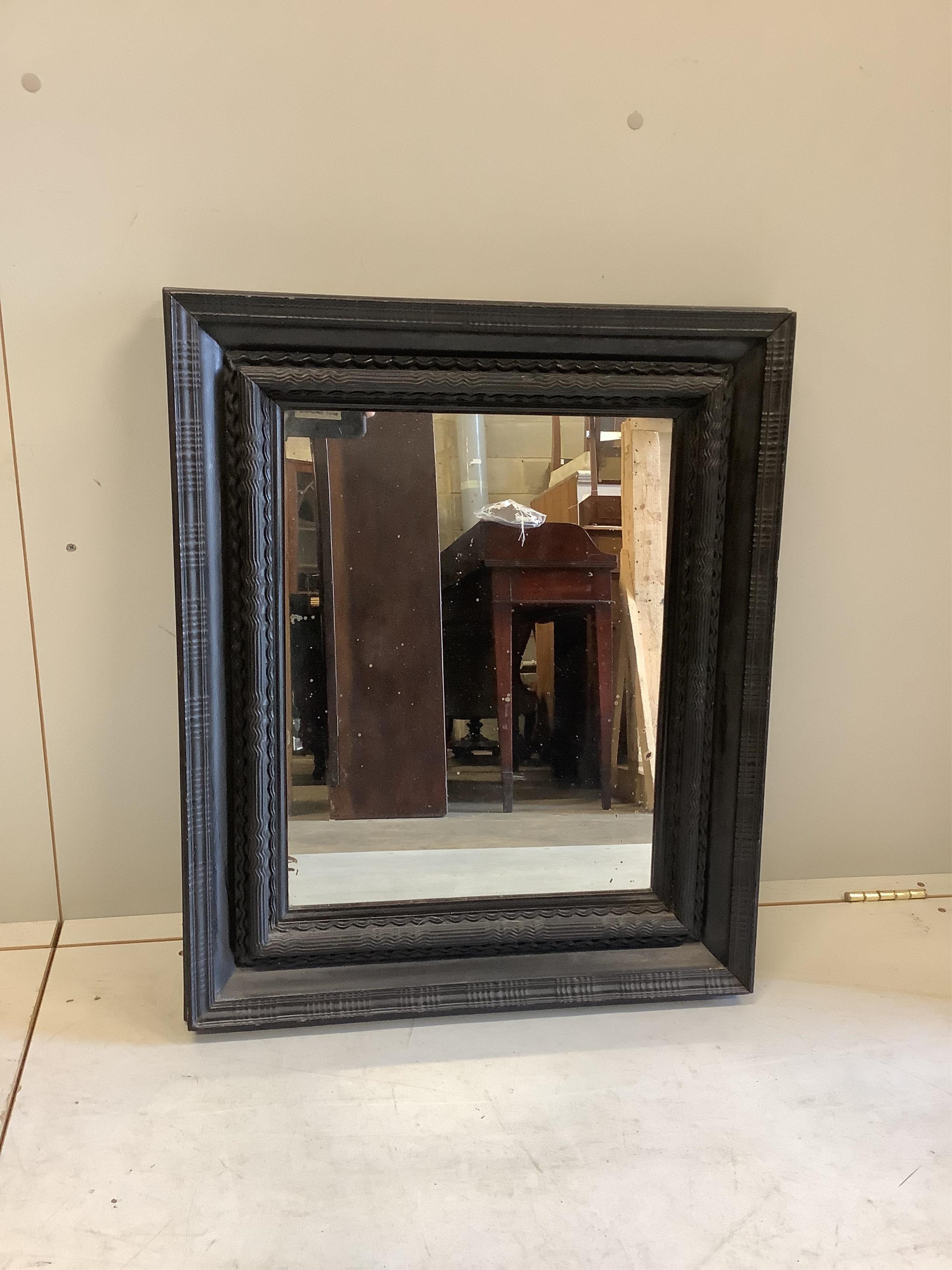 A Dutch ebonised ripple moulded frame, now a wall mirror, width 61cm, height 74cm. Condition - good